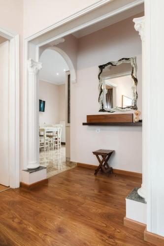 a living room with a mirror on the wall at Angelikis Maisonette in Kastoria