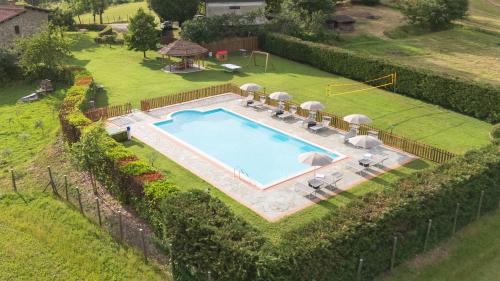 an overhead view of a swimming pool in a yard at La Pietraia by VacaVilla in Poppi