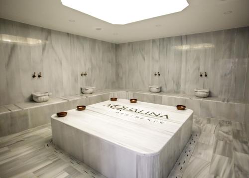 a white table in a room with three toilets at Aqualina C3-4 by HolidayKeys in Kyrenia