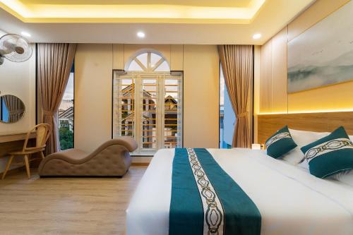 a bedroom with a large bed and a window at Green Airport Hotel 2 in Ho Chi Minh City
