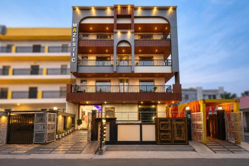 a building with lights on the side of it at Mazestic Bay Hotel & Banquet in Noida