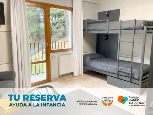 a bedroom with bunk beds and a balcony at Apartamentos Midi 3000 in Formigal
