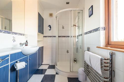 a bathroom with a shower and a sink at Homeview - Elie & Earlsferry in Elie