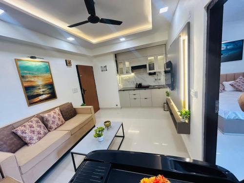 a living room with a couch and a bed at Phool Ghar by Hrittika in Siroli