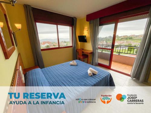 a bedroom with two stuffed animals sitting on a bed at Hotel Acquamaris 3000 in Sanxenxo