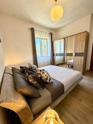 a bedroom with a large bed with pillows on it at Casa Gemelli in San Fedele Intelvi