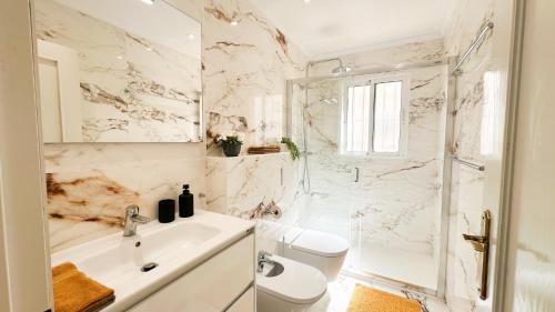 a bathroom with a shower and a toilet and a sink at NEW Villa Cabo Roig Coco-Mat 2 in Playas de Orihuela