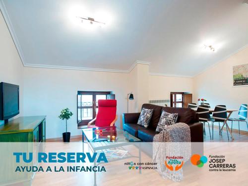 a living room with a couch and a table at Apartamentos Señorio de Haro 3000 in Haro
