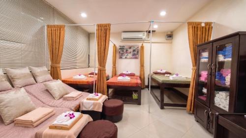 a living room with a couch and a table at K.V.Mansion in Bangkok