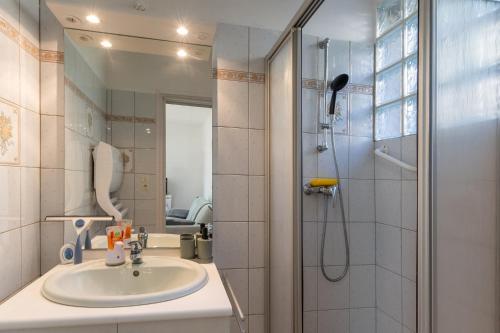 a bathroom with a sink and a shower at My Alba in Jaujac