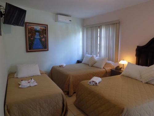 Hotel Los Pinosにあるベッド