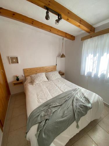 a bedroom with a large bed in a room at Casa Perico Reyes in Cartagena