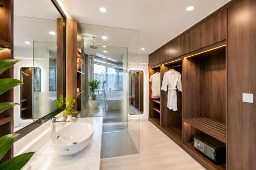 a bathroom with a sink and a mirror at G8 Center Hotel Saigon in Ho Chi Minh City