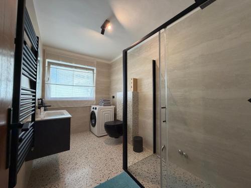 a bathroom with a toilet and a sink at Apartment Ana Pool Residence in Preko