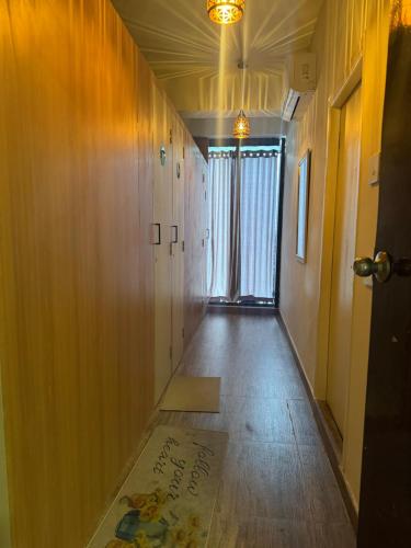 an empty hallway with a sign on the floor at FarGo Hotels By Lowfare Hotels in Bangalore