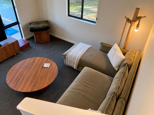a living room with a couch and a table at Kalamata - Adults Only Country Escape in Boyup Brook
