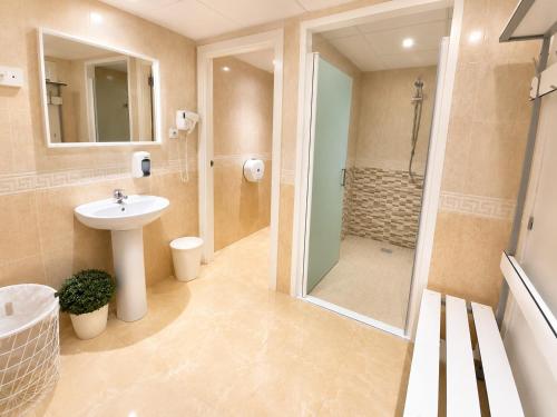 a bathroom with a sink and a shower at Aparthotel SunClub Salou in Salou