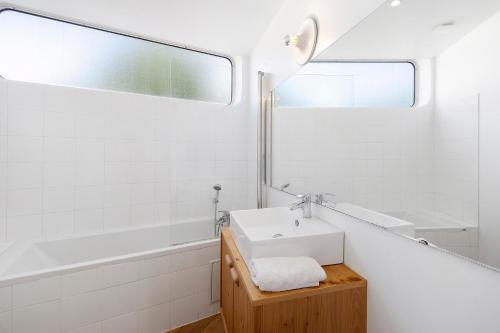 a bathroom with a sink and a mirror at Gite Design La Station in Angoisse