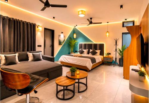 a living room with a bed and a couch at Boho Mount Abu in Mount Ābu