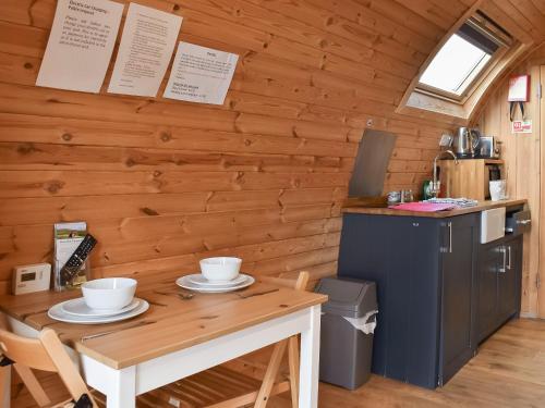 a small kitchen with a table and a small refrigerator at Selker View-Uk1397 in Corney