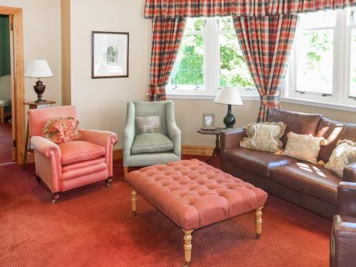 a living room with a couch and two chairs at Hall Teasses Lodge - Uk52175 in Leven