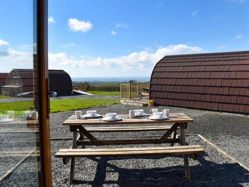 a wooden table with cups and saucers on it at Barn Scar-Uk1394 in Corney