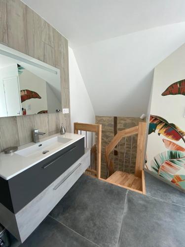 a bathroom with a sink and a mirror at Ma Cabane in Mouret