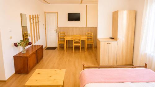 a bedroom with a table and a dining room at Tuz House R2 in Bakuriani