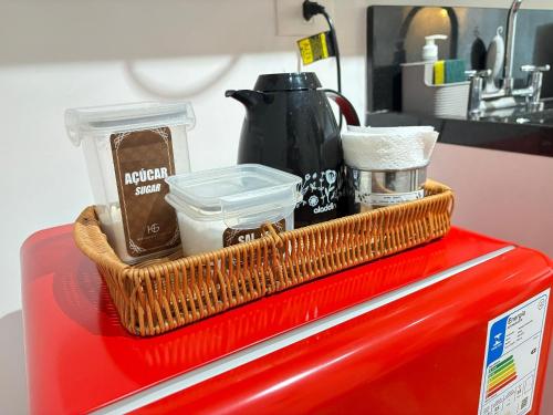 a basket of items on top of a red appliance at HLB_1006- Studio Completo com Vaga | Próx. GRU in Guarulhos