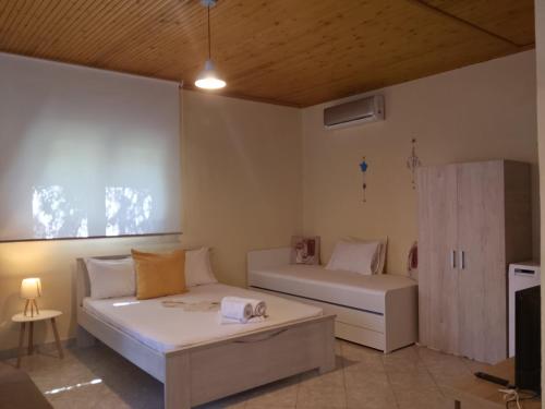 a bedroom with two beds in a room at private house in Sozopoli