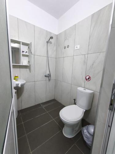 a small bathroom with a toilet and a sink at Rezidenca Nanaj in Vlorë