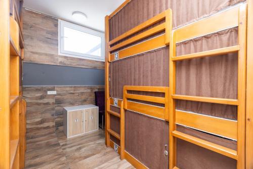 a bedroom with bunk beds and a window at AISHA Hostel in Ljubljana