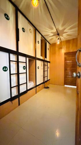 an empty room with a room with a door at Lowfare Hotels Bengaluru in Bangalore