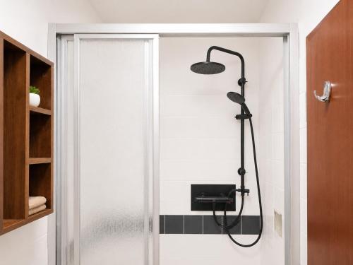 a shower in a bathroom with a glass door at Ferienwohnung Seeblick 24 in Winterberg