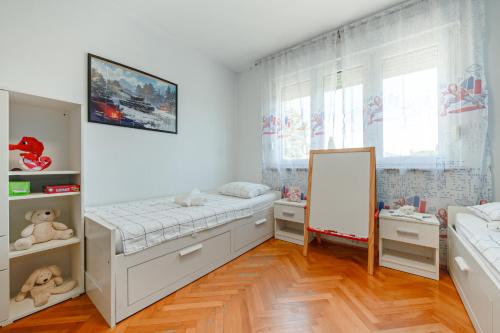 a bedroom with a bed and a mirror in it at Apartment Niksa in Pula