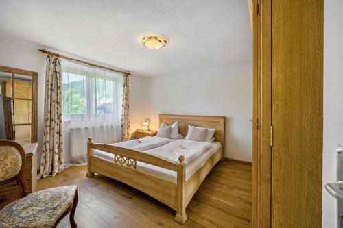a bedroom with a bed and a window at Ferienwohnung Sophie in Ruhpolding