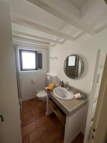 a bathroom with a sink and a toilet at Authentic village house in Goult