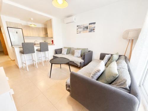 a living room with a couch and a table at Condado de Alhama 5 SV29 in Alhama de Murcia