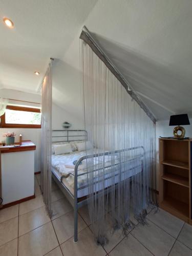 a bedroom with a bed with a canopy at Milla Sky in Varaždinske Toplice