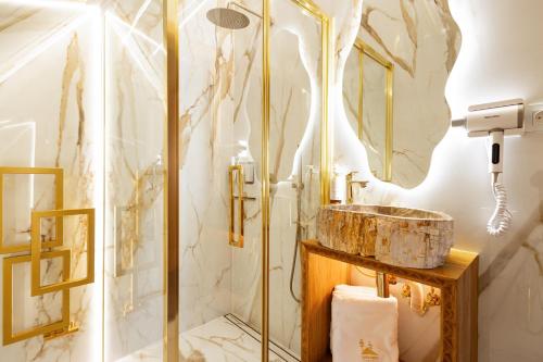 a bathroom with a shower and a sink at Tatra Forest Apartments in Zakopane