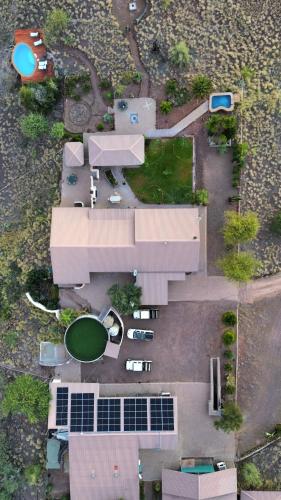 an overhead view of a parking lot with solar panels at Boscia African Farm in Omomas
