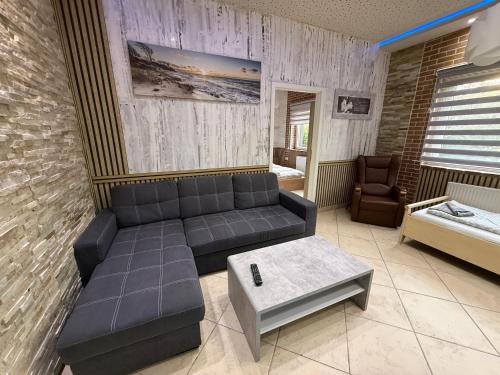 a living room with a couch and a table at Apartament bei Oberndorf in Oberndorf bei Schwanenstadt