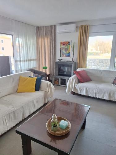 a living room with a couch and a coffee table at Marina Seaside Escape in Malinska