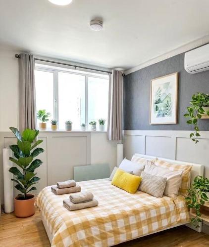 a bedroom with a large bed with pillows on it at CROKE PARK STUDIO in Dublin