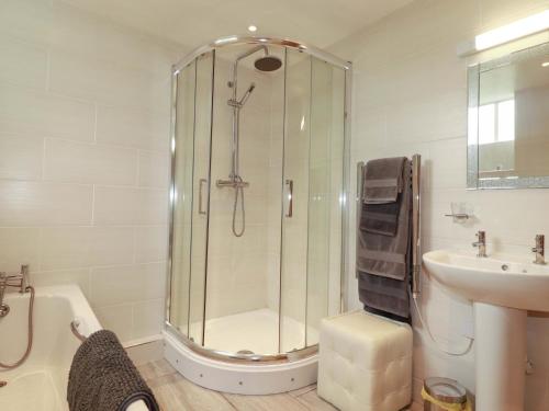 a bathroom with a shower and a sink at The Water Mill at Boyton Mill in Launceston