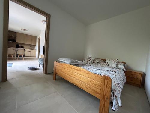 a bedroom with a bed and a large mirror at Prázdninový domeček in Heřmanice