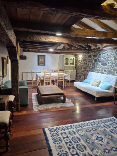 a living room with a couch and a table at Casona Valle de Soba in Regules