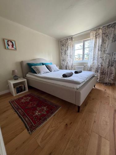 a bedroom with a large bed in a room at Kolbergarden in Olsztyn