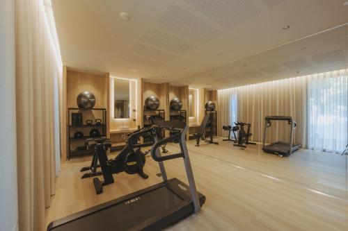 a room with a gym with exercise equipment in it at Evangelisti Palace in Bellaria-Igea Marina