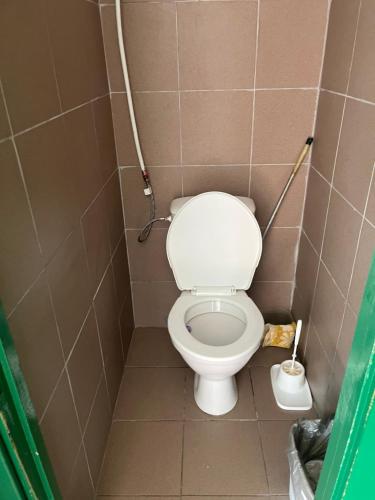 a small bathroom with a toilet in a stall at Budget Room Vilnius in Vilnius